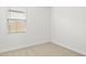 Bright bedroom with neutral walls and carpet at 1559 S 239Th Dr, Buckeye, AZ 85326