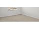 Simple bedroom featuring neutral wall paint and carpet at 1559 S 239Th Dr, Buckeye, AZ 85326