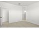 Bedroom with door to bathroom and neutral carpeting at 1559 S 239Th Dr, Buckeye, AZ 85326