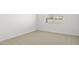 Spacious bedroom with neutral carpeting and large window at 1559 S 239Th Dr, Buckeye, AZ 85326
