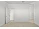 Light and airy bedroom with carpet and access to bathroom at 1559 S 239Th Dr, Buckeye, AZ 85326