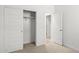 Bright bedroom with closet and access to a bathroom at 1559 S 239Th Dr, Buckeye, AZ 85326