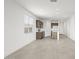 Modern kitchen with dark wood cabinets and recessed lighting at 1559 S 239Th Dr, Buckeye, AZ 85326