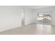 Bright living room with tile floors and sliding glass door at 1559 S 239Th Dr, Buckeye, AZ 85326