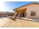 Backyard patio with seating area and solar panels at 16027 N 158Th Ct, Surprise, AZ 85374