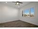 Spacious bedroom with wood-look floors and large window at 16637 W La Reata Ave, Goodyear, AZ 85395