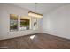 Bright dining room with large windows and chandelier at 16637 W La Reata Ave, Goodyear, AZ 85395