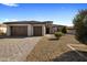 Beautiful home with a two-car garage and desert landscaping at 16637 W La Reata Ave, Goodyear, AZ 85395