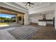 Open living space with sliding doors to backyard and large area rug at 16637 W La Reata Ave, Goodyear, AZ 85395