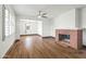 Open living space with brick fireplace and wood-look floors at 1727 W Flower St, Phoenix, AZ 85015