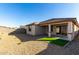 Home exterior, backyard with gravel and artificial turf at 18398 W Monte Lindo Ln, Surprise, AZ 85387