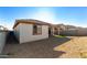 Home's exterior back view, gravel and turf at 18398 W Monte Lindo Ln, Surprise, AZ 85387