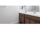 Double vanity bathroom with modern finishes at 18398 W Monte Lindo Ln, Surprise, AZ 85387