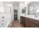 Double vanity bathroom with soaking tub and shower at 18398 W Monte Lindo Ln, Surprise, AZ 85387