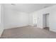 Bright bedroom with en-suite bathroom and neutral carpet at 18398 W Monte Lindo Ln, Surprise, AZ 85387