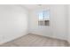 Simple bedroom with neutral wall paint and carpet at 18398 W Monte Lindo Ln, Surprise, AZ 85387