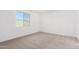 Spacious bedroom with neutral wall paint and carpet at 18398 W Monte Lindo Ln, Surprise, AZ 85387