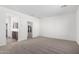 Bedroom with access to bathroom and hallway at 18398 W Monte Lindo Ln, Surprise, AZ 85387