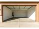 Attached garage with open door and ample space at 18398 W Monte Lindo Ln, Surprise, AZ 85387