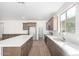 Modern kitchen with an island and stainless steel appliances at 18398 W Monte Lindo Ln, Surprise, AZ 85387