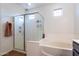 Bathroom with shower, bathtub, and double vanity at 19087 E Walnut Ct, Queen Creek, AZ 85142