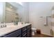 Modern bathroom boasts dual vanities, a shower, and updated fixtures at 19087 E Walnut Ct, Queen Creek, AZ 85142