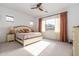 Bright bedroom with large window and light-colored furnishings at 19087 E Walnut Ct, Queen Creek, AZ 85142