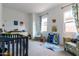 Charming Bedroom with crib, armchair, and plenty of storage at 19087 E Walnut Ct, Queen Creek, AZ 85142