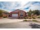 Exterior of house with stone and red accents at 19087 E Walnut Ct, Queen Creek, AZ 85142