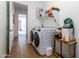 Convenient laundry room with washer, dryer, and additional storage at 19087 E Walnut Ct, Queen Creek, AZ 85142