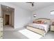 Spacious main bedroom with carpeted floors and large windows at 19087 E Walnut Ct, Queen Creek, AZ 85142