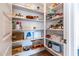 Well-organized pantry with ample shelving for storage at 19087 E Walnut Ct, Queen Creek, AZ 85142