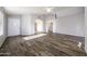 Light-filled living room featuring wood-look tile flooring at 20315 N 106Th Ave, Peoria, AZ 85382