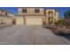 Two-story house with three-car garage and desert landscaping at 2122 E Desert Inn Dr, Chandler, AZ 85249