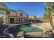 Relaxing kidney shaped pool with rock waterfall feature at 2122 E Desert Inn Dr, Chandler, AZ 85249