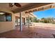 Spacious covered patio with terracotta tile flooring at 22419 N Los Caballos Dr, Scottsdale, AZ 85255