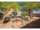 Backyard patio area with trees and seating at 23735 W Wayland Dr, Buckeye, AZ 85326