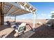 Relaxing backyard patio with covered seating area and gravel landscaping at 24211 N 168Th Ln, Surprise, AZ 85387
