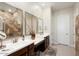 Double vanity bathroom with a large shower and modern finishes at 24211 N 168Th Ln, Surprise, AZ 85387