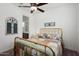 Bedroom with a brass bed frame and patterned bedding at 24211 N 168Th Ln, Surprise, AZ 85387