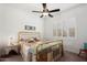 Bright bedroom with a gold metal bed frame and window with shutters at 24211 N 168Th Ln, Surprise, AZ 85387
