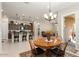 Charming dining area with a round wooden table and four chairs at 24211 N 168Th Ln, Surprise, AZ 85387