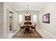 Formal dining room with a wooden table and access to backyard patio at 24211 N 168Th Ln, Surprise, AZ 85387