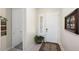 Bright and airy entryway with tile flooring and decorative wall art at 24211 N 168Th Ln, Surprise, AZ 85387