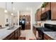 Modern kitchen with granite countertops and stainless steel appliances at 24211 N 168Th Ln, Surprise, AZ 85387