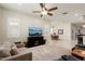 Open living room with a view of the dining area and kitchen at 24211 N 168Th Ln, Surprise, AZ 85387