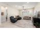 Relaxing living room featuring comfortable seating and a large TV at 24211 N 168Th Ln, Surprise, AZ 85387