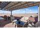Outdoor patio with pergola, seating area, and views of the backyard at 24211 N 168Th Ln, Surprise, AZ 85387