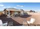 Relaxing covered patio with comfortable seating in a large backyard at 24211 N 168Th Ln, Surprise, AZ 85387