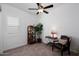 Cozy sitting area with a comfortable chair and display cabinet at 24211 N 168Th Ln, Surprise, AZ 85387